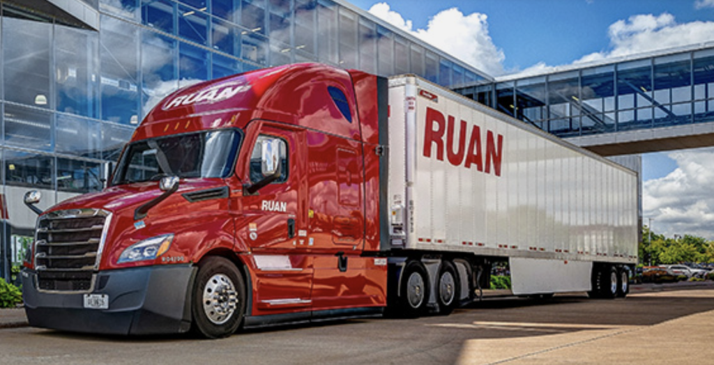 Ruan tractor-trailer in front of modern building