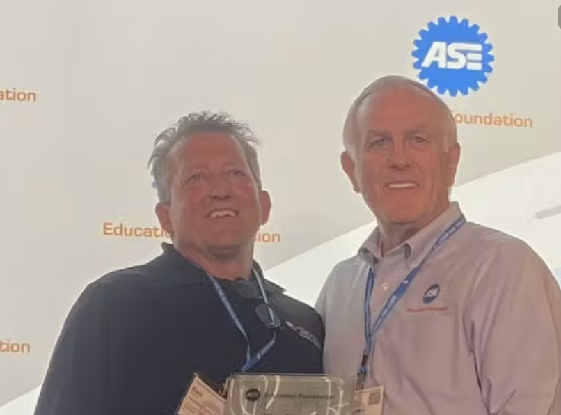 Ken Kunz (left) and Mike Coley, ASE Education Foundation president, at the ASE Instructor Training Conference in St. Louis.