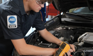 Professional technician working on engine