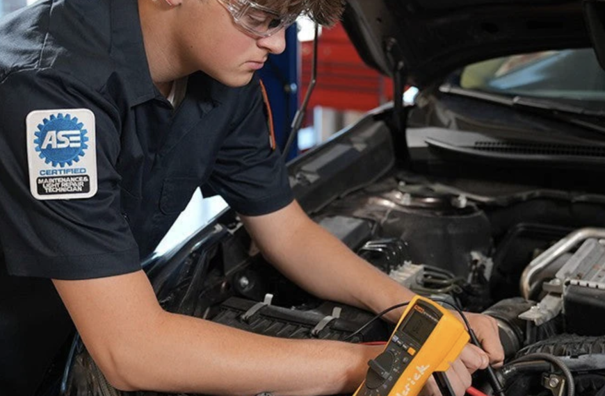 Professional technician working on engine