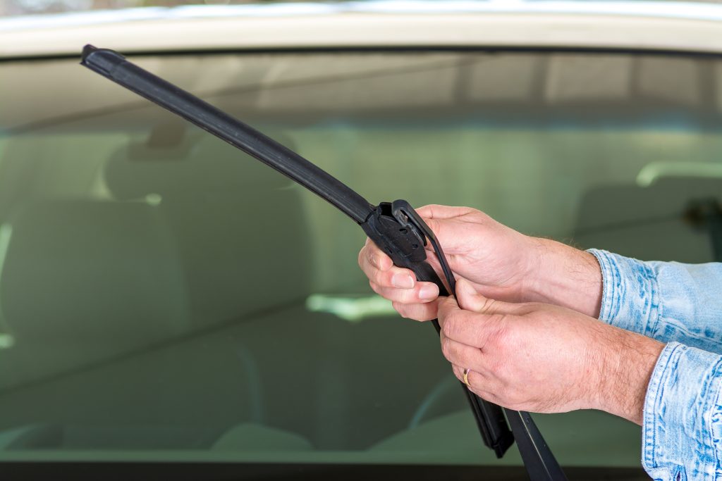 Technician attaching wiper blade